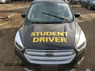 2018 Ford Escape SE z VIN 1FMCU9GDXJUD21466, wystawiony jako Copart lot #46266395 z przebiegiem Nie podano mil oraz Szkoda całkowita • Salvage title. Historia ofert i sprzedaży dostępna na DreamBid. Obrazek 12.
