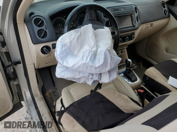 2012 Volkswagen Tiguan SEL with VIN WVGAV7AX2CW529098, listed as a Copart auction lot 53349565 with 128,603 mi miles and Salvage Title. Bid and sale history available at DreamBid. Image 8.