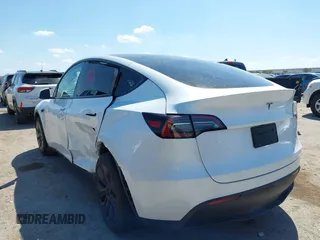 2024 Tesla Model Y with VIN 7SAYGDED0RA327806, listed as a IAAI auction lot 42096752 with 13,244 mi miles and . Bid and sale history available at DreamBid. Image 3.