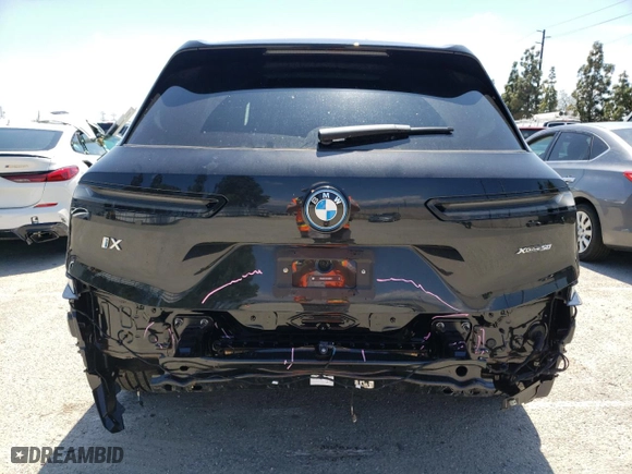 2024 BMW iX xDrive50 with VIN WB523CF05RCN96948, listed as a Copart auction lot 50858304 with 8,923 mi miles and Salvage Title. Bid and sale history available at carsss.com. Image 6.