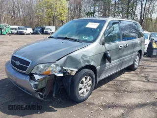 2005 Kia Sedona LX with VIN KNDUP132X56678100, listed as a IAAI auction lot 42085299 with 115,217 mi miles. Bid and sale history available at carsss.com. Image 2.