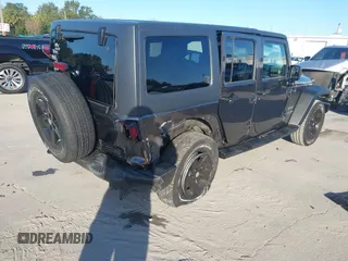 2018 Jeep Wrangler JK Unlimited Sport S with VIN 1C4BJWDG3JL900973, listed as a IAAI auction lot 41239817 with 50,952 mi miles. Bid and sale history available at carsss.com. Image 4.