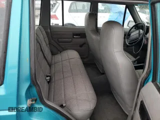 1996 Jeep Cherokee SE z VIN 1J4FJ28S9TL234675, wystawiony jako Copart lot #44796545 z przebiegiem 113 663 mil mil oraz Szkody całkowita. Historia ofert i sprzedaży dostępna na DreamBid. Obrazek 10.