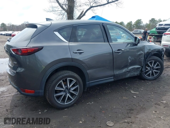 2018 Mazda CX-5 Grand Touring with VIN JM3KFBDM6J0388540, listed as a IAAI auction lot 41963726 with 103,148 mi miles. Bid and sale history available at carsss.com. Image 4.