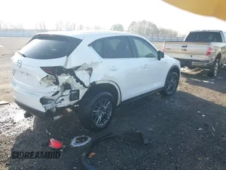 2019 Mazda CX-5 Touring z VIN JM3KFACM0K1564330, wystawiony jako IAAI lot #41797276 z przebiegiem 112 100 mil mil oraz . Historia ofert i sprzedaży dostępna na DreamBid. Obrazek 4.