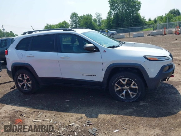 2014 Jeep Cherokee Trailhawk z VIN 1C4PJMBS0EW188976, wystawiony jako IAAI lot #42587233 z przebiegiem 191 670 mil mil oraz . Historia ofert i sprzedaży dostępna na DreamBid. Obrazek 13.