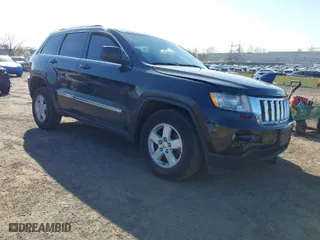 2012 Jeep Grand Cherokee Laredo with VIN 1C4RJFAG5CC118826, listed as a IAAI auction lot 42039801 with 158,153 mi miles. Bid and sale history available at carsss.com. Image 1.
