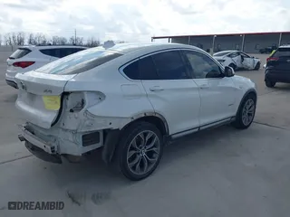 2015 BMW X4 xDrive28i with VIN 5UXXW3C53F0M88714, listed as a IAAI auction lot 41483692 with 132,054 mi miles. Bid and sale history available at carsss.com. Image 4.