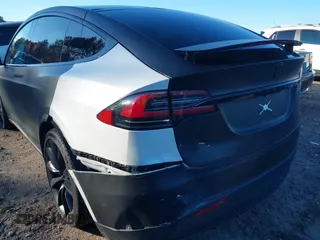 2020 Tesla Model X Long Range with VIN 5YJXCDE28LF298553, listed as a IAAI auction lot 40863184 with 54,031 mi miles and . Bid and sale history available at DreamBid. Image 6.