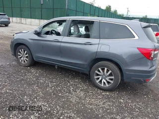 2019 Honda Pilot EX-L with VIN 5FNYF6H5XKB096065, listed as a IAAI auction lot 42631239 with 171,768 mi miles and . Bid and sale history available at DreamBid. Image 3.