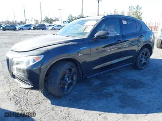 2022 Alfa Romeo Stelvio Ti with VIN ZASPAKBN5N7D24275, listed as a IAAI auction lot 41360975 with 24,668 mi miles. Bid and sale history available at carsss.com. Image 2.