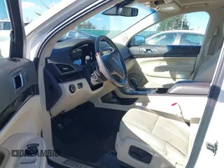 2013 Lincoln MKT EcoBoost with VIN 2LMHJ5AT8DBL55167, listed as a IAAI auction lot 41894396 with 121,114 mi miles. Bid and sale history available at carsss.com. Image 5.