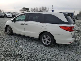 2019 Honda Odyssey EX-L with VIN 5FNRL6H72KB014960, listed as a Copart auction lot 48701035 with 131,921 mi miles and Salvage Title. Bid and sale history available at carsss.com. Image 2.