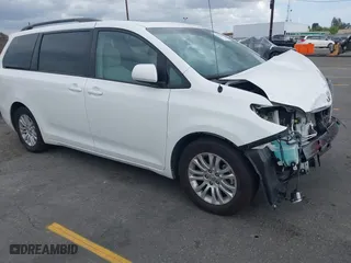 2014 Toyota Sienna XLE with VIN 5TDYK3DCXES470852, listed as a IAAI auction lot 42053266 with 48,512 mi miles. Bid and sale history available at carsss.com. Image 1.