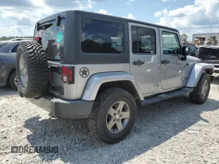 2013 Jeep Wrangler Unlimited Sport with VIN 1C4BJWDG4DL628518, listed as a Copart auction lot 65029795 with 142,852 mi miles and Salvage title. Bid and sale history available at DreamBid. Image 3.