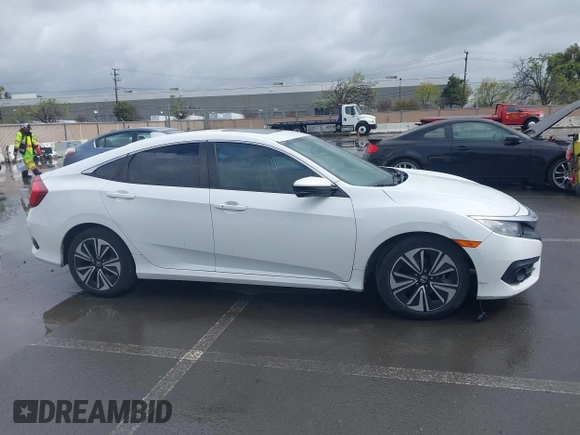 2017 Honda Civic EX-L z VIN 2HGFC1F79HH635156, wystawiony jako IAAI lot #41922115 z przebiegiem 142 565 mil mil oraz . Historia ofert i sprzedaży dostępna na DreamBid. Obrazek 13.