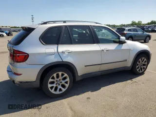 2012 BMW X5 35i with VIN 5UXZV4C5XCL749204, listed as a Copart auction lot 62012985 with 94,636 mi miles and Clean title. Bid and sale history available at DreamBid. Image 3.