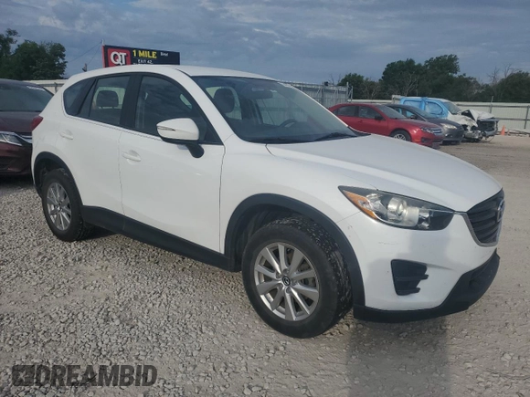 2016 Mazda CX-5 Sport with VIN JM3KE2BY0G0729349, listed as a Copart auction lot 62469735 with 88,247 mi miles and Salvage title. Bid and sale history available at DreamBid. Image 4.