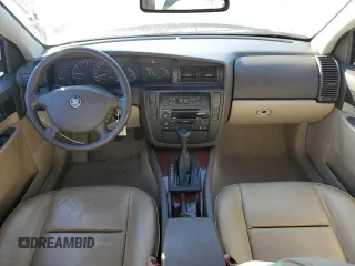 2001 Cadillac Catera z VIN W06VR54R21R039740, wystawiony jako Copart lot #77206494 z przebiegiem 41 180 mil mil oraz Szkody całkowita. Historia ofert i sprzedaży dostępna na DreamBid. Obrazek 8.