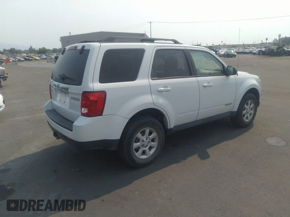 2008 Mazda Tribute Touring with VIN 4F2CZ96138KM32735, listed as a IAAI auction lot 31145122 with 206,608 mi miles and . Bid and sale history available at DreamBid. Image 4.