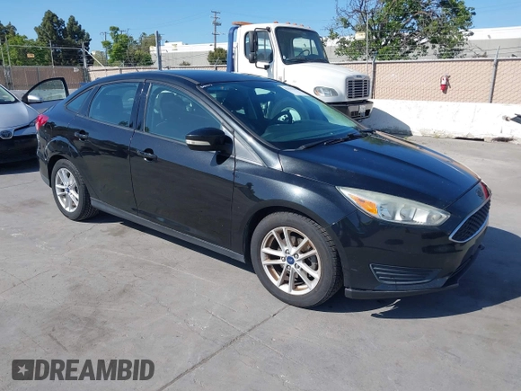 2015 Ford Focus SE with VIN 1FADP3F23FL313614, listed as a IAAI auction lot 42153320 with 121,346 mi miles. Bid and sale history available at carsss.com. Image 1.