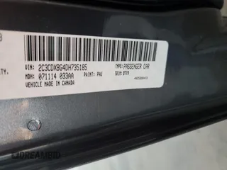 2013 Dodge Charger SE z VIN 2C3CDXBG4DH735185, wystawiony jako Copart lot #56763685 z przebiegiem 119 640 mil mil oraz Szkody całkowita. Historia ofert i sprzedaży dostępna na DreamBid. Obrazek 12.