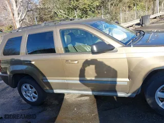 2009 Jeep Grand Cherokee Laredo with VIN 1J8GS48K79C516320, listed as a IAAI auction lot 41353131 with 166,739 mi miles. Bid and sale history available at carsss.com. Image 13.