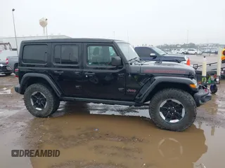 2019 Jeep Wrangler Unlimited Rubicon z VIN 1C4HJXFNXKW511193, wystawiony jako IAAI lot #41452579 z przebiegiem 91 857 mil mil oraz . Historia ofert i sprzedaży dostępna na DreamBid. Obrazek 14.