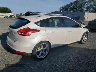 2015 Ford Focus Titanium z VIN 1FADP3N24FL262321, wystawiony jako Copart lot #59635525 z przebiegiem Nie podano mil oraz Szkoda całkowita • Salvage title. Historia ofert i sprzedaży dostępna na DreamBid. Obrazek 3.