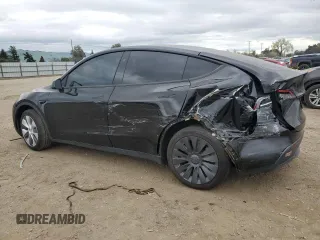 2023 Tesla Model Y Long Range with VIN 7SAYGDEE1PF923998, listed as a Copart auction lot 48954205 with 21,525 mi miles and Salvage Title. Bid and sale history available at DreamBid. Image 2.