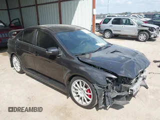 2015 Mitsubishi Lancer Evolution GSR z VIN JA32W8FV2FU020047, wystawiony jako IAAI lot #41890897 z przebiegiem 121 089 mil mil oraz . Historia ofert i sprzedaży dostępna na DreamBid. Obrazek 1.
