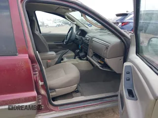 2003 Jeep Grand Cherokee Laredo with VIN 1J4GX48S83C576892, listed as a IAAI auction lot 42082865 with 212,157 mi miles. Bid and sale history available at carsss.com. Image 5.