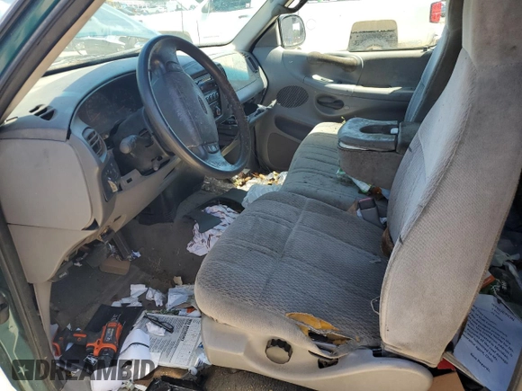 1998 Ford F-150 z VIN 1FTZX1768WNB23317, wystawiony jako Copart lot #52336895 z przebiegiem 288 431 mil mil oraz Szkoda całkowita • Salvage title. Historia ofert i sprzedaży dostępna na DreamBid. Obrazek 7.