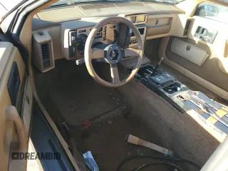 1987 Pontiac Fiero GT z VIN 1G2PG119XHP200243, wystawiony jako Copart lot #74389864 z przebiegiem 109 478 mil mil oraz Tytuł czysty. Historia ofert i sprzedaży dostępna na DreamBid. Obrazek 8.