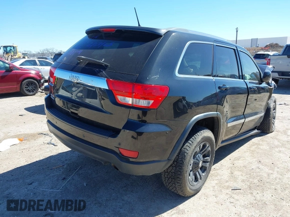 2013 Jeep Grand Cherokee Laredo with VIN 1C4RJFAG2DC643926, listed as a IAAI auction lot 41723575 with 125,048 mi miles. Bid and sale history available at carsss.com. Image 4.