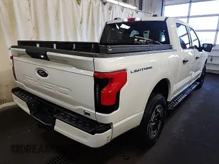 2023 Ford F-150 Lightning Pro with VIN 1FT6W1EVXPWG31056, listed as a IAAI auction lot 42090651 with 342 mi miles. Bid and sale history available at carsss.com. Image 1.