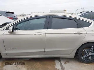 2016 Ford Fusion Titanium Hybrid with VIN 3FA6P0RU9GR143203, listed as a IAAI auction lot 41332144 with 94,357 mi miles. Bid and sale history available at carsss.com. Image 15.