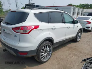 2014 Ford Escape SE with VIN 1FMCU9G99EUC81141, listed as a IAAI auction lot 42436279 with 123,947 mi miles and . Bid and sale history available at DreamBid. Image 4.