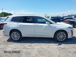 2020 Cadillac XT6 FWD Premium Luxury z VIN 1GYKPCRS1LZ228982, wystawiony jako IAAI lot #41975364 z przebiegiem 84 803 mil mil oraz . Historia ofert i sprzedaży dostępna na DreamBid. Obrazek 12.