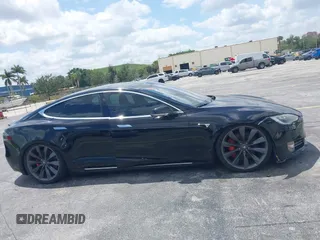 2017 Tesla Model S 100D with VIN 5YJSA1E47HF185734, listed as a IAAI auction lot 42076544 with 56,682 mi miles. Bid and sale history available at carsss.com. Image 12.