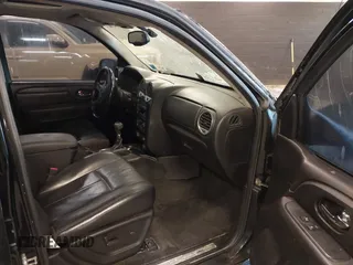 2007 GMC Envoy SLE with VIN 1GKDT13S872298442, listed as a IAAI auction lot 41343565 with 106,818 mi miles. Bid and sale history available at carsss.com. Image 5.