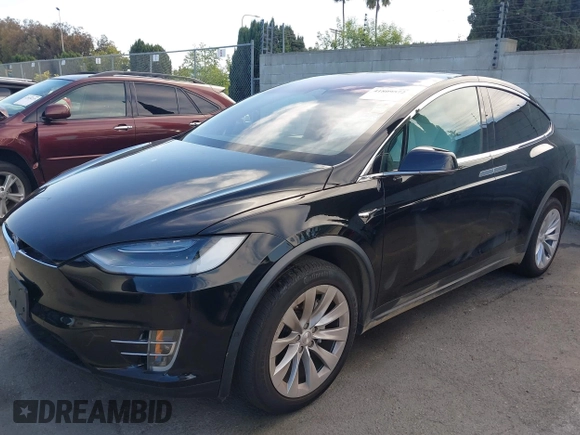 2020 Tesla Model X Long Range with VIN 5YJXCDE20LF265157, listed as a IAAI auction lot 41809572 with 58,599 mi miles. Bid and sale history available at carsss.com. Image 6.
