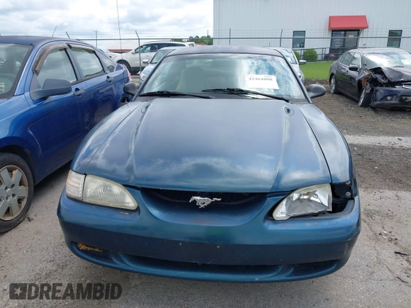 1996 Ford Mustang GT z VIN 1FALP42XXTF137304, wystawiony jako IAAI lot #42464808 z przebiegiem 166 565 mil mil oraz . Historia ofert i sprzedaży dostępna na DreamBid. Obrazek 13.
