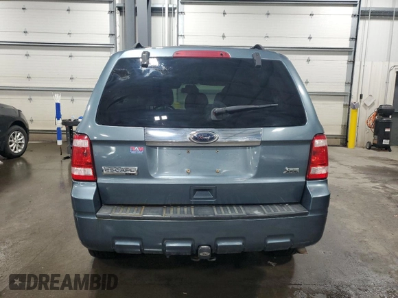 2010 Ford Escape Limited with VIN 1FMCU0EG8AKA54266, listed as a Copart auction lot 59367135 with 123,598 mi miles and Salvage title. Bid and sale history available at DreamBid. Image 6.