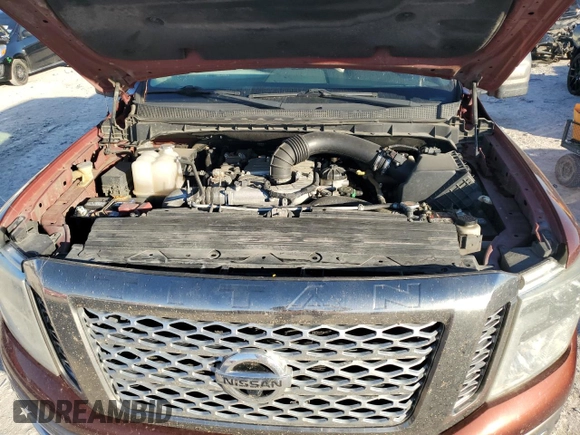 2016 Nissan Titan Platinum Reserve z VIN 1N6BA1F2XGN506885, wystawiony jako Copart lot #80171524 z przebiegiem 318 311 mil mil oraz Czysty tytuł • Clean title. Historia ofert i sprzedaży dostępna na DreamBid. Obrazek 11.