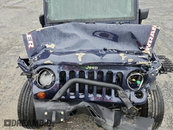 2013 Jeep Wrangler Unlimited Sport z VIN 1C4BJWDG9DL509685, wystawiony jako Copart lot #58521415 z przebiegiem 254 452 mil mil oraz Szkoda całkowita • Salvage title. Historia ofert i sprzedaży dostępna na DreamBid. Obrazek 11.
