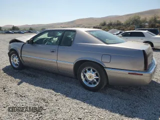 1996 Cadillac Eldorado z VIN 1G6EL12Y3TU618242, wystawiony jako Copart lot #70318844 z przebiegiem Nie podano mil oraz Szkody całkowita. Historia ofert i sprzedaży dostępna na DreamBid. Obrazek 2.