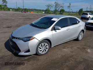 2018 Toyota Corolla L with VIN 5YFBURHEXJP810003, listed as a IAAI auction lot 42526648 with 84,546 mi miles and . Bid and sale history available at DreamBid. Image 18.