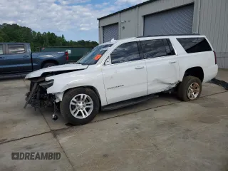 2015 Chevrolet Suburban LT with VIN 1GNSKJKC7FR637642, listed as a Copart auction lot 55247875 with 223,918 mi miles and Salvage title. Bid and sale history available at DreamBid. Image 1.