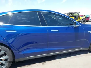 2016 Tesla Model S 70 kWh Battery with VIN 5YJSA1E10GF126433, listed as a IAAI auction lot 42169558 with 120,182 mi miles and . Bid and sale history available at carsss.com. Image 13.